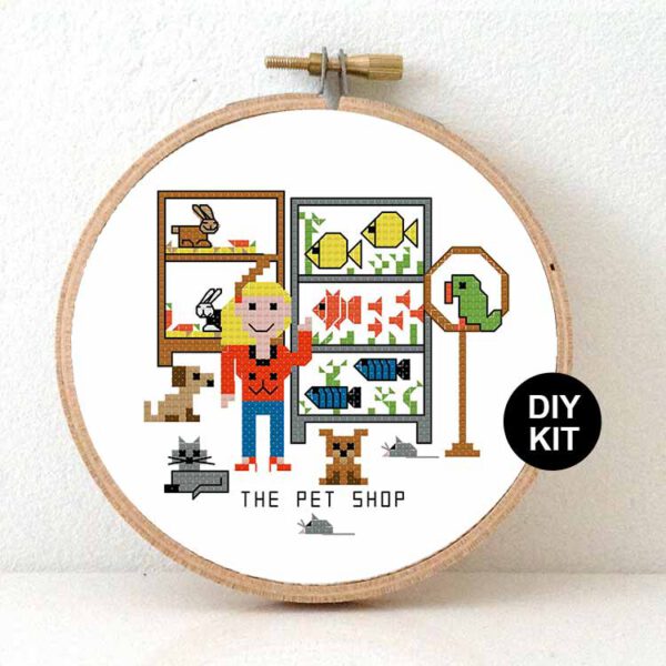Female pet shop owner cross stitch kit | Studio Koekoek