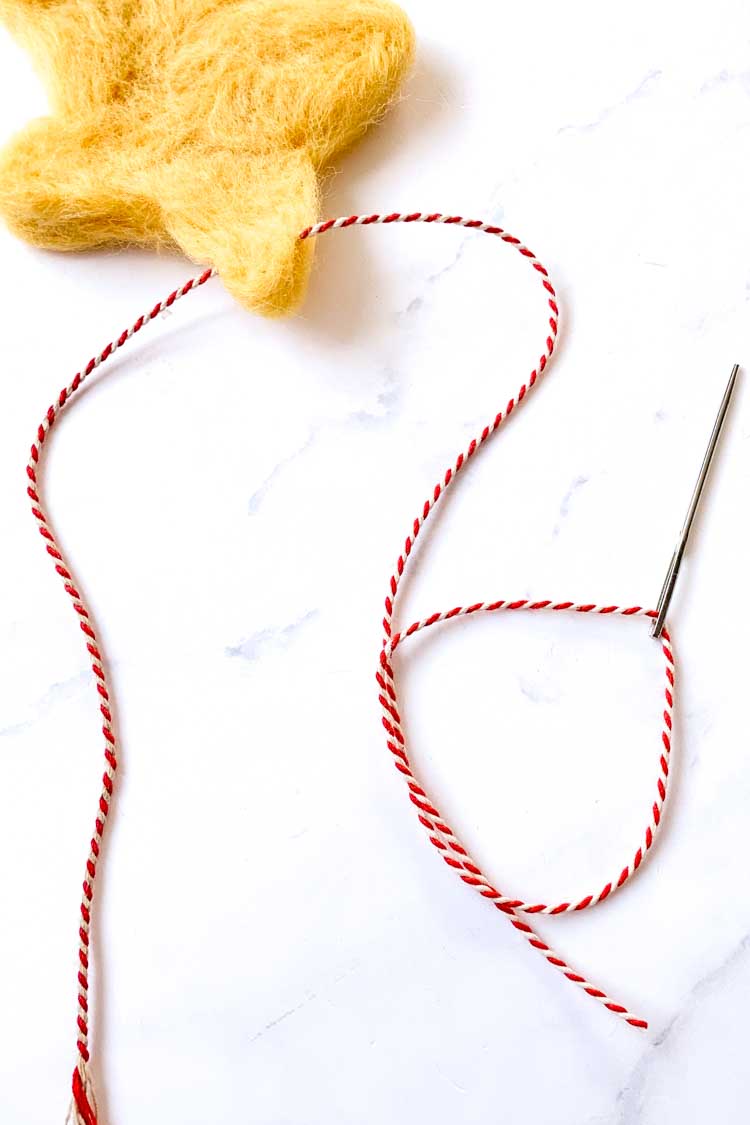 how to needle felt a star with a cookie cutter - attaching a hanging thread