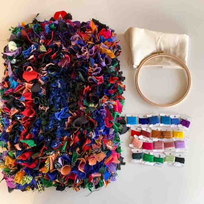One of a Kind. Textile wall art from Malawi matched with 20 colors DMC floss, hoop and eco canvas. s1895